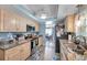 Cozy kitchen with stainless steel appliances, light cabinets, and granite countertops at 3957 Tarpon Pointe Cir, Palm Harbor, FL 34684