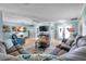 Relaxing living room with a sectional sofa, stylish decor, and plenty of natural light at 3957 Tarpon Pointe Cir, Palm Harbor, FL 34684