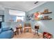 Open living room featuring comfortable seating, decorative shelves, and an inviting atmosphere at 3957 Tarpon Pointe Cir, Palm Harbor, FL 34684