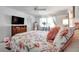Comfortable main bedroom with a ceiling fan, closet and bright window allowing for natural light at 3957 Tarpon Pointe Cir, Palm Harbor, FL 34684