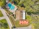 Aerial shot of a community clubhouse and pool area, featuring ample seating and well-maintained facilities at 3957 Tarpon Pointe Cir, Palm Harbor, FL 34684