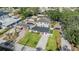 An aerial shot shows the well-maintained house and lawn at 401 N Manhattan Ave, Tampa, FL 33609