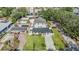 Aerial view displaying a single Gathering residence bordered by manicured lawns, neighboring homes, and established trees at 401 N Manhattan Ave, Tampa, FL 33609