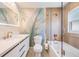 Stylish bathroom featuring updated fixtures, a shower-tub combo, and a leaf mural at 401 N Manhattan Ave, Tampa, FL 33609