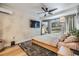 A light and bright bedroom with natural wood floors and a modern ceiling fan at 401 N Manhattan Ave, Tampa, FL 33609