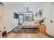 Comfortable bedroom with ample natural light, modern rug, and designer touches at 401 N Manhattan Ave, Tampa, FL 33609
