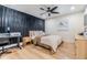 Cozy bedroom with a ceiling fan and dark curtains for adjustable lighting at 401 N Manhattan Ave, Tampa, FL 33609