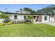 Charming single-story home with a neatly landscaped front yard at 401 N Manhattan Ave, Tampa, FL 33609