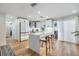 Bright kitchen with white cabinets, quartz countertops, stainless steel appliances, and a center island at 401 N Manhattan Ave, Tampa, FL 33609