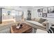 Bright living room with a neutral sofa, wooden coffee table, and stylish decor at 401 N Manhattan Ave, Tampa, FL 33609