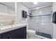 A modern bathroom featuring sleek fixtures, a glass-enclosed shower, and elegant tile work at 4103 Gulf Blvd # 106, St Pete Beach, FL 33706