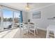 A bright dining area with sliding glass doors to the outside and waterfront views at 4103 Gulf Blvd # 106, St Pete Beach, FL 33706