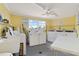 Well-lit laundry room with multiple washers, dryers, and a functional sink area at 4103 Gulf Blvd # 106, St Pete Beach, FL 33706