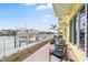 Waterfront patio with outdoor seating, a boat dock, and scenic canal views at 4103 Gulf Blvd # 106, St Pete Beach, FL 33706