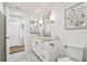 Bright bathroom with dual sink vanity, updated fixtures, and decorative tile floor at 4204 Saltwater Blvd, Tampa, FL 33615