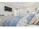 Bedroom features a ceiling fan, white trim and a nicely decorated bed at 4204 Saltwater Blvd, Tampa, FL 33615
