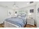 Bright bedroom with window, ceiling fan, and two nightstands at 4204 Saltwater Blvd, Tampa, FL 33615
