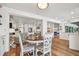 Bright dining area with an open-concept design to the kitchen and the living room with hardwood flooring throughout at 4204 Saltwater Blvd, Tampa, FL 33615