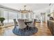 Charming dining area featuring a round table, pendant lighting, and scenic window views at 4204 Saltwater Blvd, Tampa, FL 33615