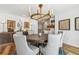 Inviting dining room with round table, tufted chairs, and decorative accents at 4204 Saltwater Blvd, Tampa, FL 33615
