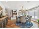 Bright dining area with a round table, comfortable seating, and modern lighting fixture at 4204 Saltwater Blvd, Tampa, FL 33615