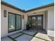 Facade of a modern home showcasing large windows and a stylish entrance at 4204 Saltwater Blvd, Tampa, FL 33615