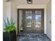 Inviting front door featuring elegant brown double doors and stone steps at 4204 Saltwater Blvd, Tampa, FL 33615