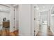 Hallway with multiple doorways and wood flooring at 4204 Saltwater Blvd, Tampa, FL 33615