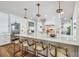Kitchen island with stools, marble countertops, and stainless steel appliances at 4204 Saltwater Blvd, Tampa, FL 33615