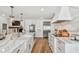 This modern kitchen boasts a large marble island with high-end appliances and plenty of storage space at 4204 Saltwater Blvd, Tampa, FL 33615