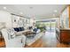 Bright living room with modern furniture, stylish decor, hardwood floors, and sliding glass doors at 4204 Saltwater Blvd, Tampa, FL 33615