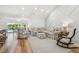 Cozy living room with backyard pool and canal access with floral pattern furniture at 4204 Saltwater Blvd, Tampa, FL 33615
