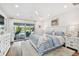 Inviting main bedroom boasting a plush rug, king bed, and sliding glass door to the outdoors at 4204 Saltwater Blvd, Tampa, FL 33615