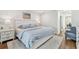 Cozy main bedroom with a plush rug, full bed, and view into hallway at 4204 Saltwater Blvd, Tampa, FL 33615