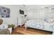 Comfortable main bedroom with a flat screen TV and light blue floral patterned bedding at 4204 Saltwater Blvd, Tampa, FL 33615