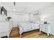 Spacious main bedroom with hardwood flooring, a ceiling fan, and plenty of closet space at 4204 Saltwater Blvd, Tampa, FL 33615