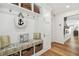 Convenient mudroom with built-in bench, storage cubbies, and coat hooks, keeping your home organized at 4204 Saltwater Blvd, Tampa, FL 33615