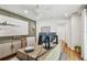 Well-lit home office featuring wood floors, modern desk setup, and stylish decor at 4204 Saltwater Blvd, Tampa, FL 33615