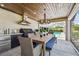 A full outdoor kitchen and dining area with views of the pool at 4204 Saltwater Blvd, Tampa, FL 33615