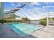 Screened-in pool featuring beautiful water views and easy access to the boat dock at 4204 Saltwater Blvd, Tampa, FL 33615