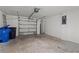 Spacious two car garage with automatic door, bare concrete floor and plenty of room for parking at 4424 Tuscan Loon Dr, Tampa, FL 33619