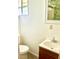 Bathroom vanity with vintage style hardware and a sink, plus a small window adding natural light at 4485 49Th N Ave, St Petersburg, FL 33714