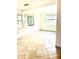 Living Room with light walls, tile floors, and many windows for natural light at 4485 49Th N Ave, St Petersburg, FL 33714
