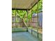 A screened-in lanai with a view of the fenced yard, perfect for enjoying the outdoors at 4485 49Th N Ave, St Petersburg, FL 33714