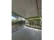 Enclosed porch offering a serene view of the yard, and privacy from the surrounding trees and foliage at 4485 49Th N Ave, St Petersburg, FL 33714