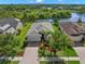 Aerial view of a single-Gathering home featuring a screened pool and mature landscaping at 4826 68Th Street E Cir, Bradenton, FL 34203