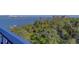 High-rise condo balcony view of waterfront scenery and lush trees at 500 N Osceola Ave # 609, Clearwater, FL 33755
