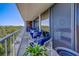 Relaxing condo balcony with seating and sliding glass doors leading to the bedroom at 500 N Osceola Ave # 609, Clearwater, FL 33755