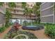 Beautiful courtyard with fountain and tropical landscaping at 500 N Osceola Ave # 609, Clearwater, FL 33755