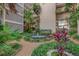 Beautiful courtyard with fountain and tropical landscaping at 500 N Osceola Ave # 609, Clearwater, FL 33755